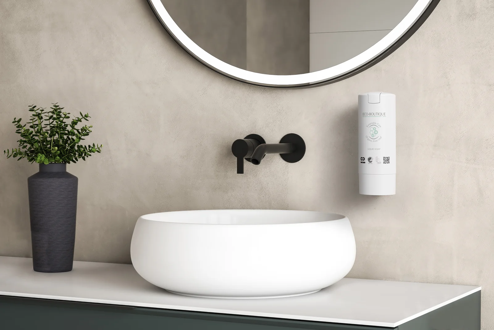 Dozator SmartCare MINI Eco-Boutique montat pe perete, lângă un lavoar rotund și o oglindă