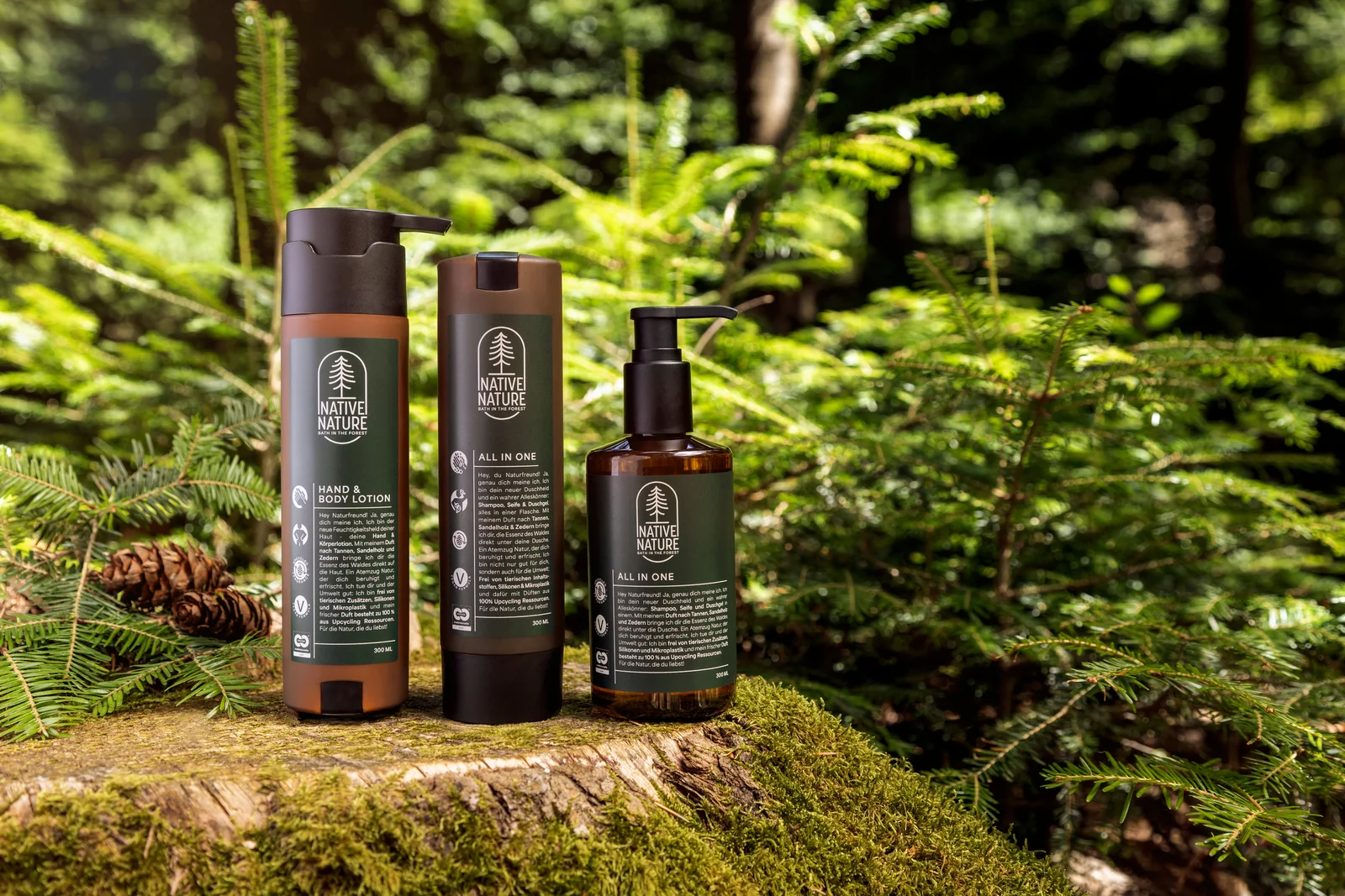 Native Nature bottles on a moss-covered trunk in the forest