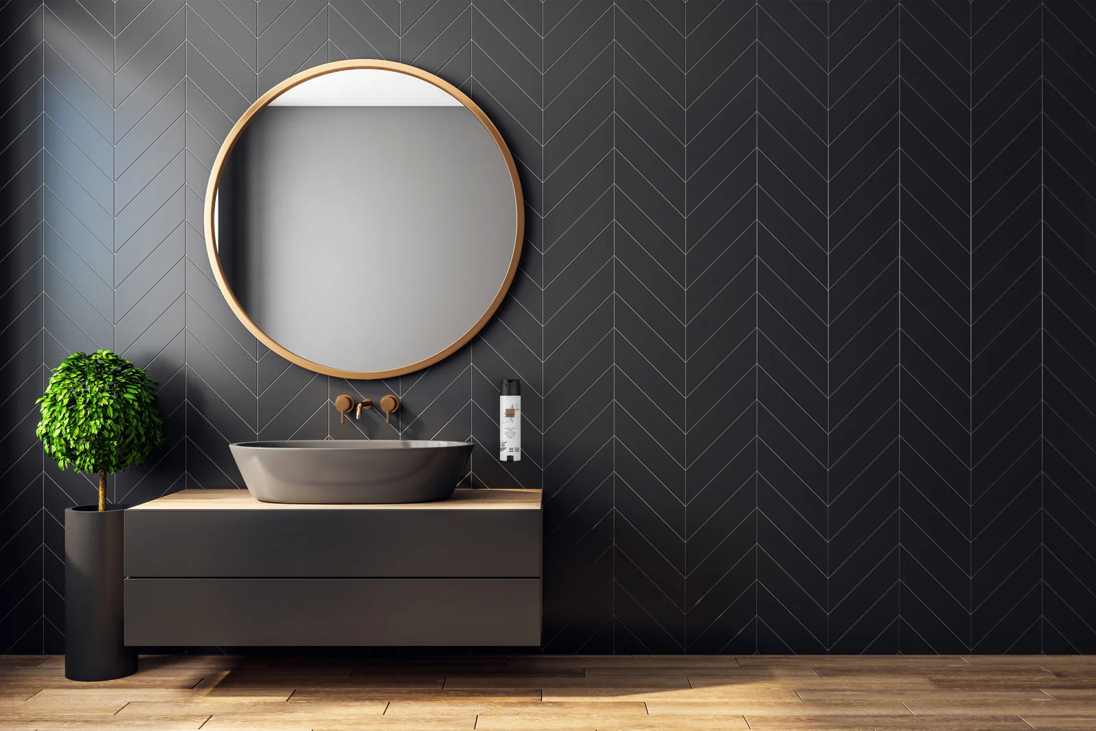 Bathroom with black zigzag tiles, a round mirror and a The Perfumer’s Garden dispenser on the wall