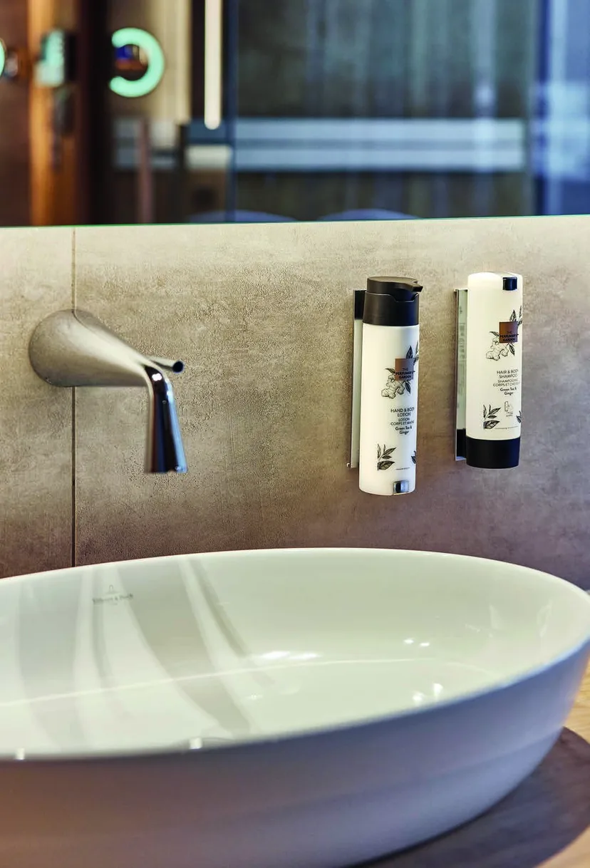 ADA SmartCare dispenser next to a hotel washbasin