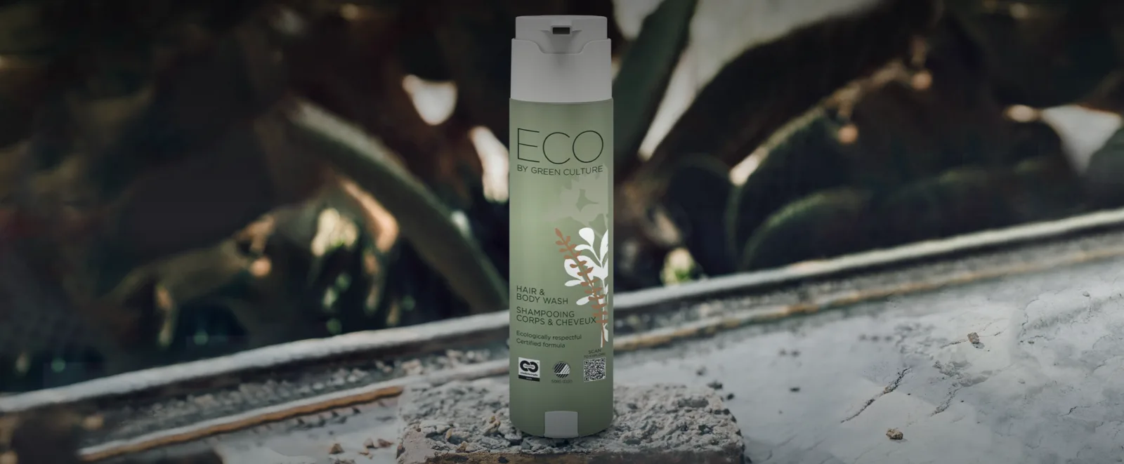 ECO by Green Culture SmartCare bottle on a stone sill among plants